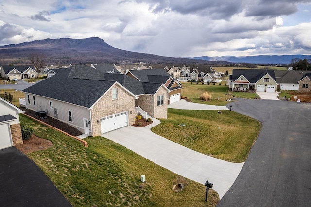 birds eye view of property featuring a mountain view