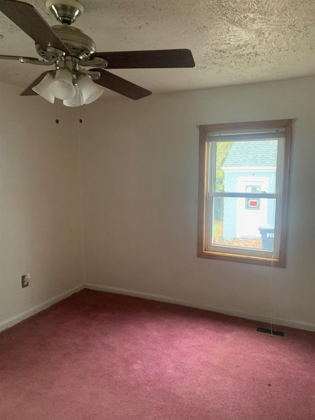 471 Gay St E, Harrisonburg, VA 22802 - carpeted empty room featuring ceiling fan, a textured ceiling, baseboards, and visible vents