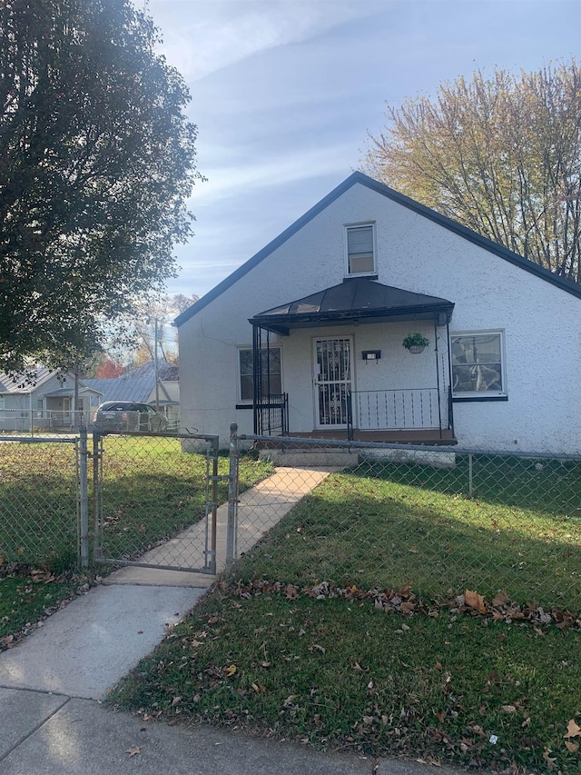 471 Gay St E, Harrisonburg, VA 22802 - bungalow-style house with a fenced front yard, stucco siding, a gate, and a front yard