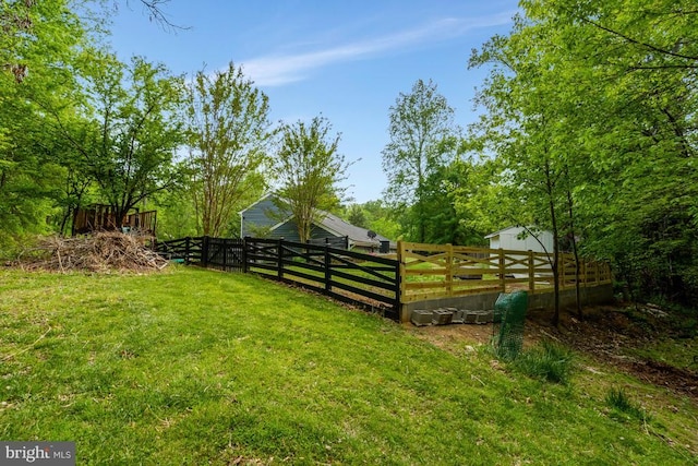  - view of yard featuring an outbuilding and fence
