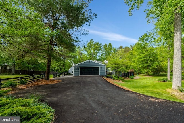  - detached garage featuring fence