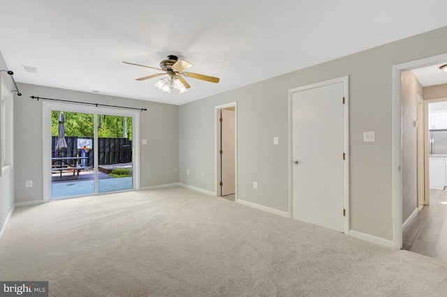  - interior space featuring baseboards, ceiling fan, and carpet