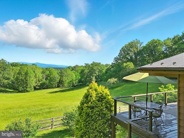 103 Castleton Ford Rd, Castleton, VA 22716 - view of green lawn with a deck, outdoor dining space, and a forest view
