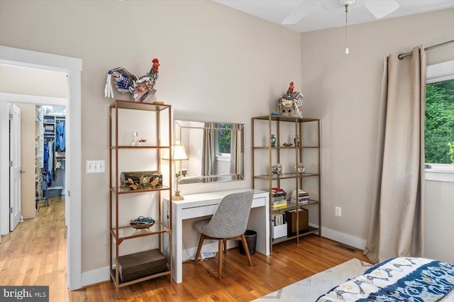 103 Castleton Ford Rd, Castleton, VA 22716 - bedroom featuring light wood-style flooring, an office area, baseboards, and a walk in closet