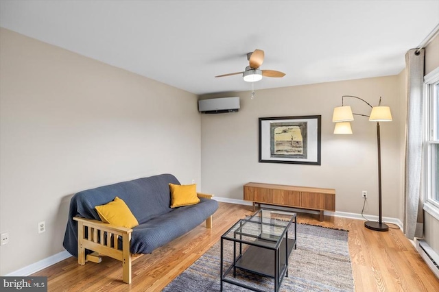 103 Castleton Ford Rd, Castleton, VA 22716 - living room with a baseboard radiator, wood finished floors, baseboards, ceiling fan, and an AC wall unit