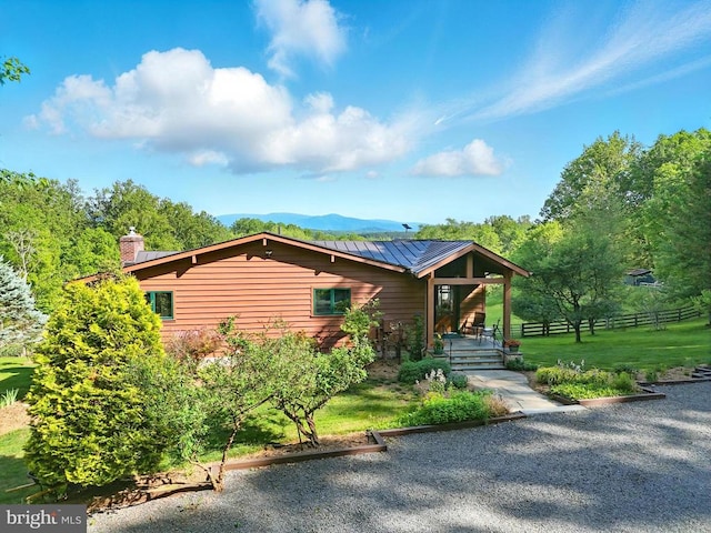 103 Castleton Ford Rd, Castleton, VA 22716 - view of front facade featuring a chimney, metal roof, and covered porch