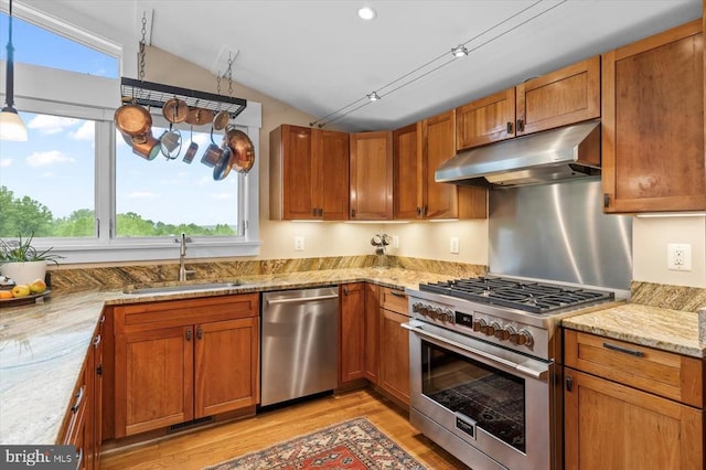 103 Castleton Ford Rd, Castleton, VA 22716 - kitchen with appliances with stainless steel finishes, under cabinet range hood, a sink, light wood finished floors, and vaulted ceiling