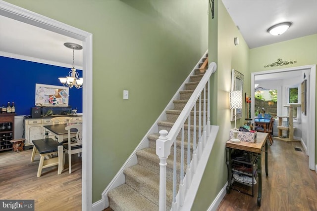 1218 Heatherbrook Ct, Fredericksburg, VA 22407 - staircase featuring wood finished floors, baseboards, a chandelier, and ornamental molding