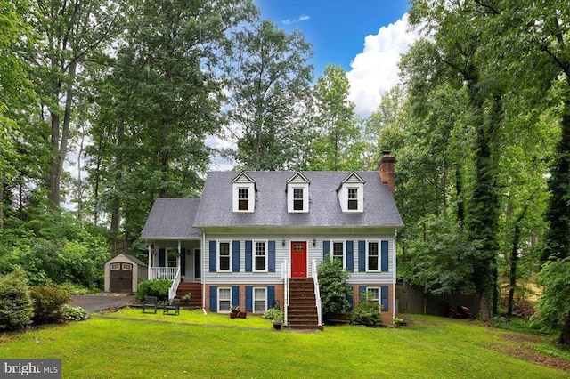 1218 Heatherbrook Ct, Fredericksburg, VA 22407 - new england style home with stairway, a chimney, covered porch, a garage, and brick siding