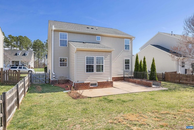 back of house featuring a fenced backyard, a patio, and a yard