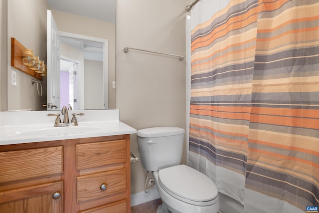 full bath featuring toilet, a shower with shower curtain, and vanity