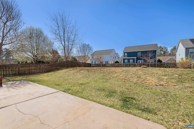 view of yard featuring a patio area and fence