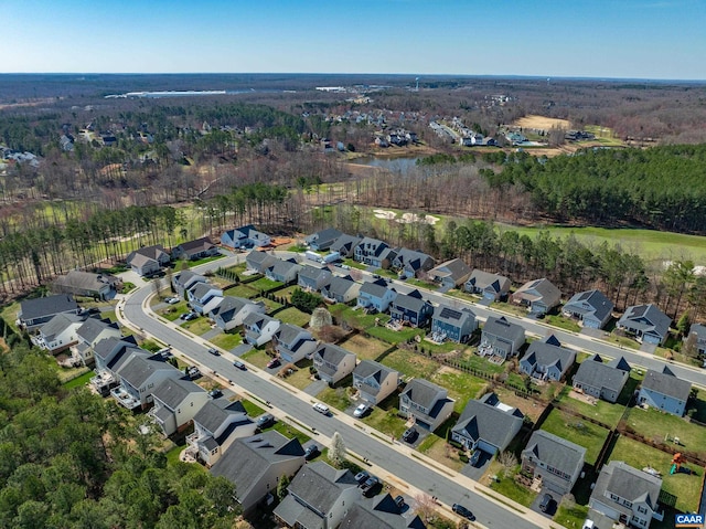 birds eye view of property with a residential view and a view of trees