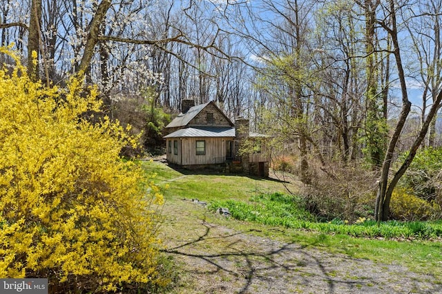 view of side of property featuring a chimney