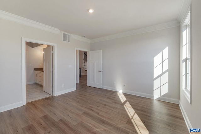 403 Bayberry Ln, Zion Crossroads, VA 22942 - empty room featuring crown molding, wood finished floors, stairs, and recessed lighting