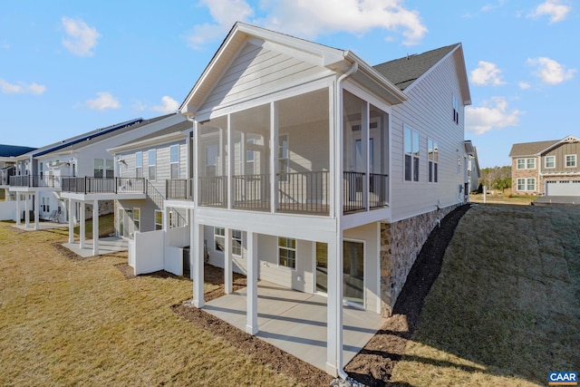 403 Bayberry Ln, Zion Crossroads, VA 22942 - view of side of property featuring a patio area, a sunroom, a residential view, and a yard