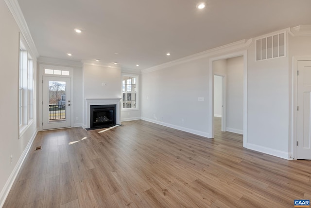 403 Bayberry Ln, Zion Crossroads, VA 22942 - unfurnished living room featuring ornamental molding, light wood-style floors, a fireplace with flush hearth, and recessed lighting