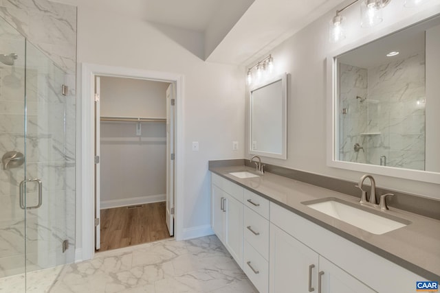403 Bayberry Ln, Zion Crossroads, VA 22942 - bathroom with marble look tile flooring, a marble finish shower, double vanity, and a spacious closet