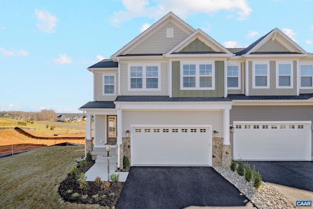 403 Bayberry Ln, Zion Crossroads, VA 22942 - view of front of home with asphalt driveway, a garage, stone siding, and board and batten siding