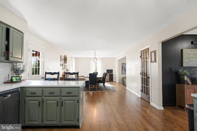 114 Wanda St W, Stanley, VA 22851 - kitchen with stainless steel dishwasher, a peninsula, light countertops, dark wood-style floors, and green cabinets