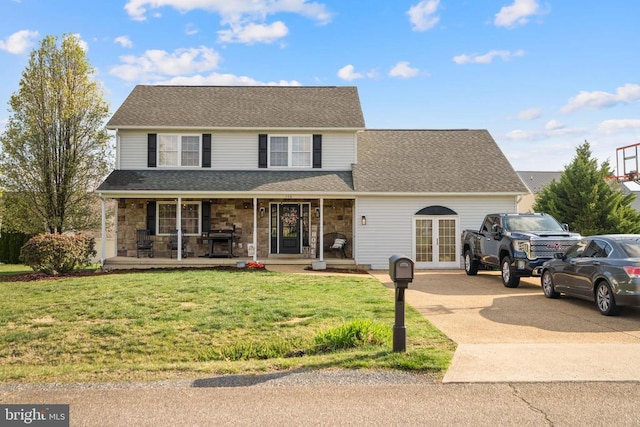 114 Wanda St W, Stanley, VA 22851 - traditional-style home with a porch, driveway, a front lawn, stone siding, and french doors