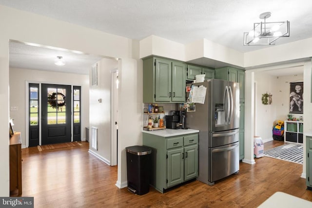 114 Wanda St W, Stanley, VA 22851 - kitchen featuring green cabinetry, stainless steel fridge with ice dispenser, wood finished floors, and light countertops