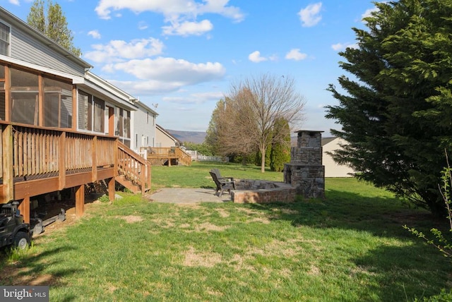 114 Wanda St W, Stanley, VA 22851 - view of green lawn with a wooden deck, a patio area, stairs, and an outdoor fire pit