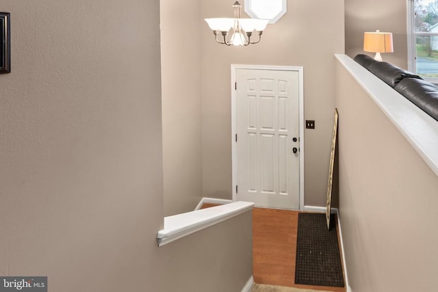 11404 Warner Dr, Fredericksburg, VA 22407 - entryway featuring a chandelier, wood finished floors, and baseboards