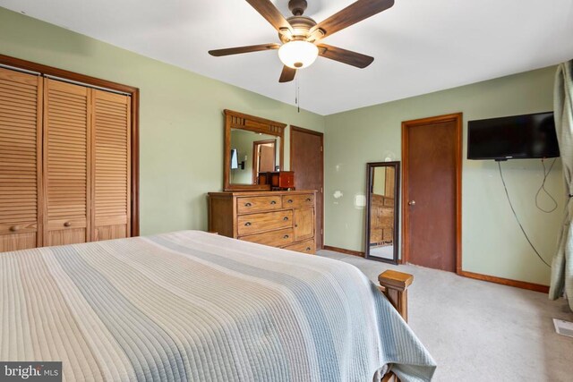 11404 Warner Dr, Fredericksburg, VA 22407 - bedroom with light colored carpet, baseboards, a closet, and a ceiling fan