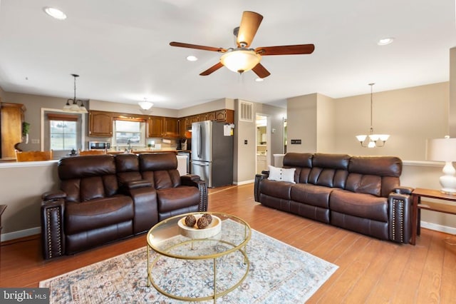 11404 Warner Dr, Fredericksburg, VA 22407 - living room featuring a chandelier, baseboards, light wood-type flooring, ceiling fan, and recessed lighting