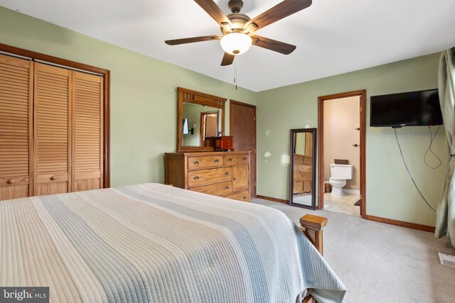 11404 Warner Dr, Fredericksburg, VA 22407 - bedroom featuring light carpet, a closet, baseboards, ceiling fan, and ensuite bathroom