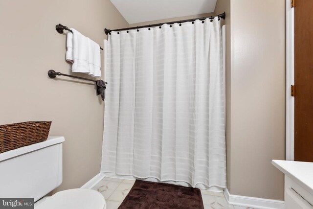11404 Warner Dr, Fredericksburg, VA 22407 - bathroom featuring toilet, marble look tile flooring, a shower with shower curtain, and vanity