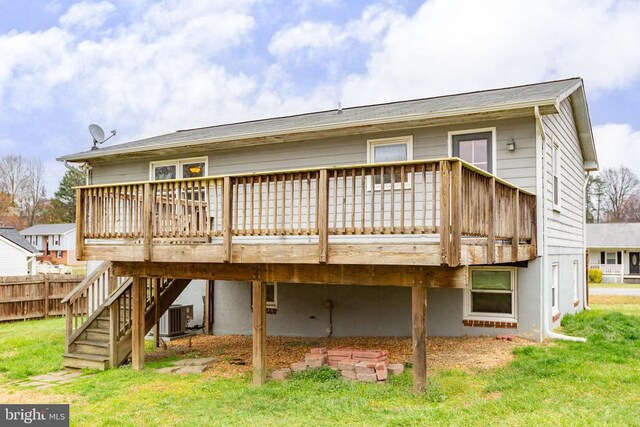 11404 Warner Dr, Fredericksburg, VA 22407 - back of property featuring central AC unit, a wooden deck, and a lawn