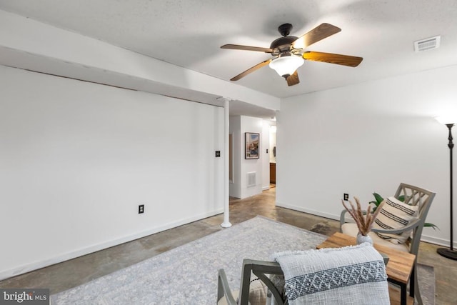 11404 Warner Dr, Fredericksburg, VA 22407 - living area with concrete floors, ceiling fan, and baseboards