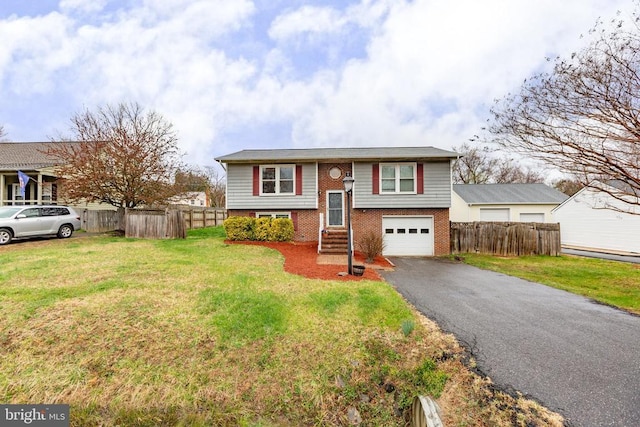 11404 Warner Dr, Fredericksburg, VA 22407 - bi-level home featuring brick siding, asphalt driveway, and a garage