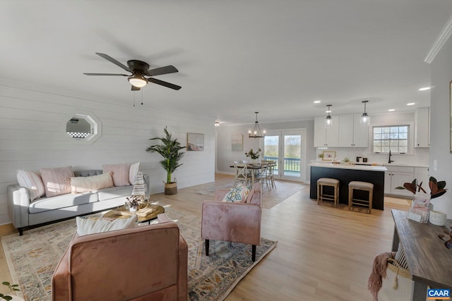 912 Shores Rd, Palmyra, VA 22963 - living area featuring crown molding, light wood-style flooring, ceiling fan with notable chandelier, and recessed lighting