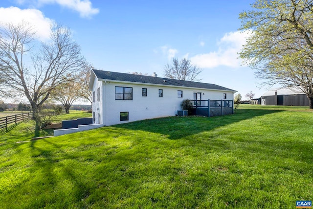 912 Shores Rd, Palmyra, VA 22963 - rear view of property featuring fence, a deck, a chimney, a lawn, and central AC unit