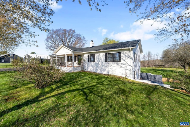 912 Shores Rd, Palmyra, VA 22963 - single story home with a chimney, a front yard, a porch, and roof with shingles