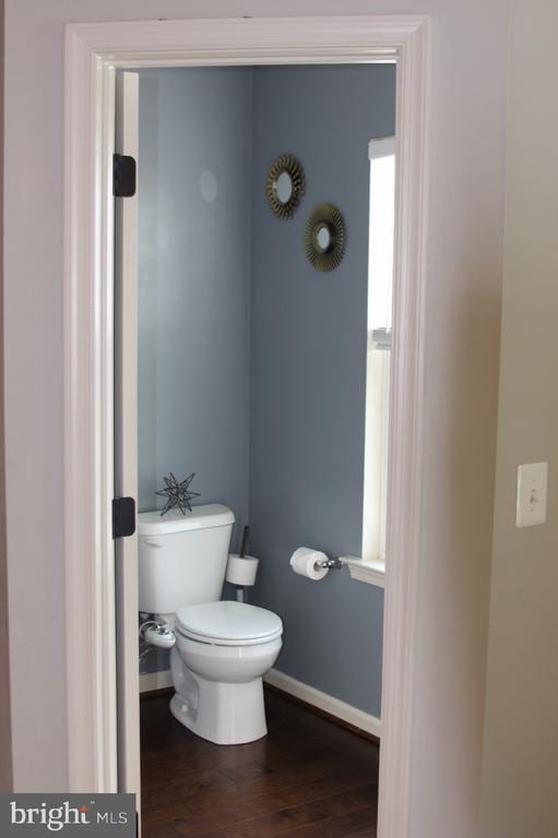 2437 Drake Ln, Fredericksburg, VA 22408 - bathroom with wood finished floors, toilet, and baseboards