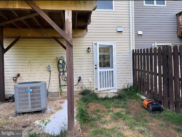 2437 Drake Ln, Fredericksburg, VA 22408 - doorway to property featuring central AC unit and fence