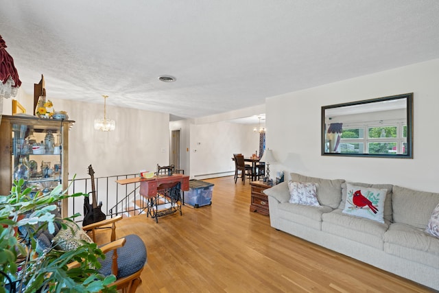 708 Woodside Ln, Waynesboro, VA 22980 - living room with a chandelier, wood finished floors, and baseboard heating
