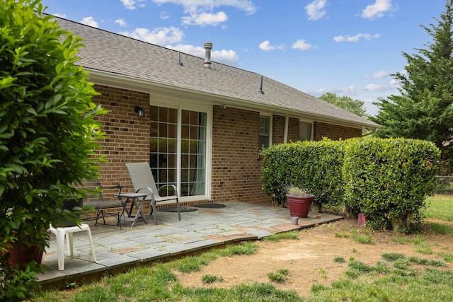 708 Woodside Ln, Waynesboro, VA 22980 - back of property with brick siding, a patio area, and roof with shingles