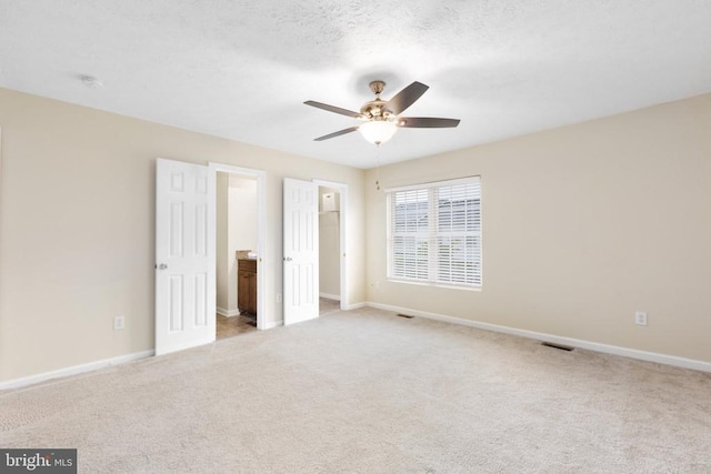 2912 Broyhill Ct, Fredericksburg, VA 22408 - unfurnished bedroom featuring carpet flooring, baseboards, ensuite bath, and a ceiling fan