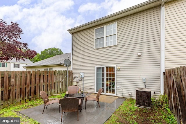 2912 Broyhill Ct, Fredericksburg, VA 22408 - back of house featuring a patio, cooling unit, and a fenced backyard