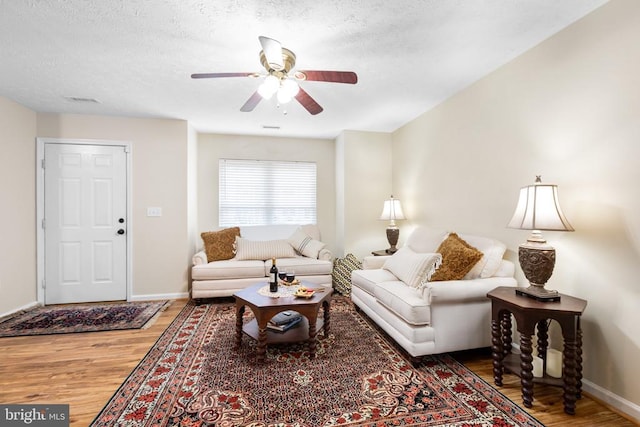 2912 Broyhill Ct, Fredericksburg, VA 22408 - living room featuring wood finished floors, a ceiling fan, baseboards, and a textured ceiling
