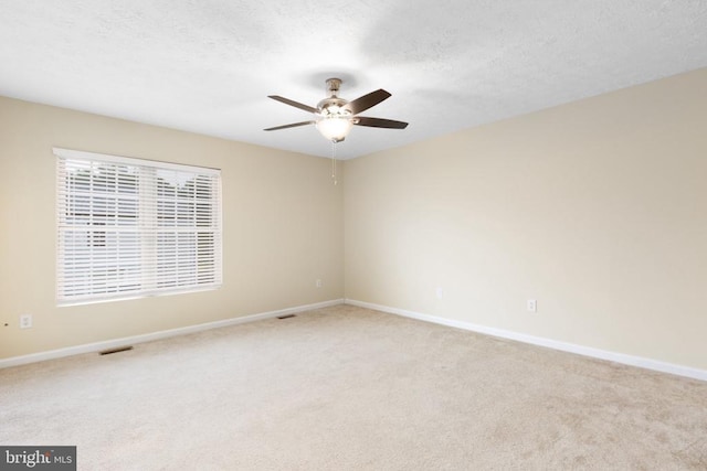 2912 Broyhill Ct, Fredericksburg, VA 22408 - unfurnished room with light carpet, ceiling fan, baseboards, and a textured ceiling