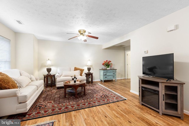 2912 Broyhill Ct, Fredericksburg, VA 22408 - living room with ceiling fan, wood finished floors, a textured ceiling, and baseboards