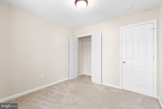 2912 Broyhill Ct, Fredericksburg, VA 22408 - unfurnished bedroom featuring carpet flooring, baseboards, a closet, and a textured ceiling