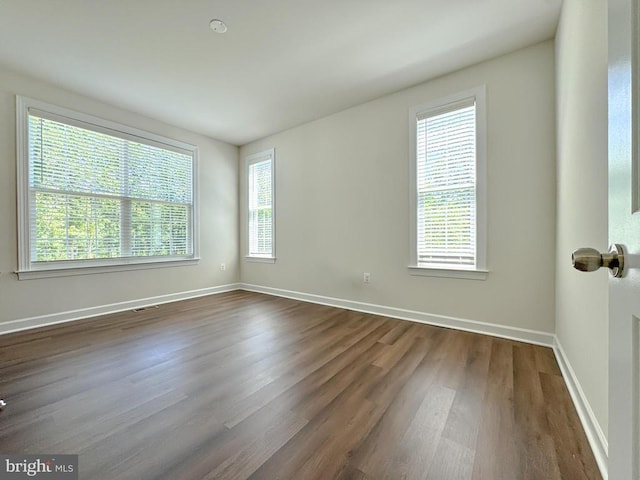 8525 Laroque Run Dr, Fredericksburg, VA 22407 - empty room with dark wood-style flooring and baseboards