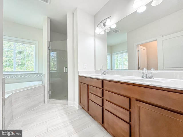 8525 Laroque Run Dr, Fredericksburg, VA 22407 - bathroom featuring tile patterned floors, a shower stall, a garden tub, and double vanity
